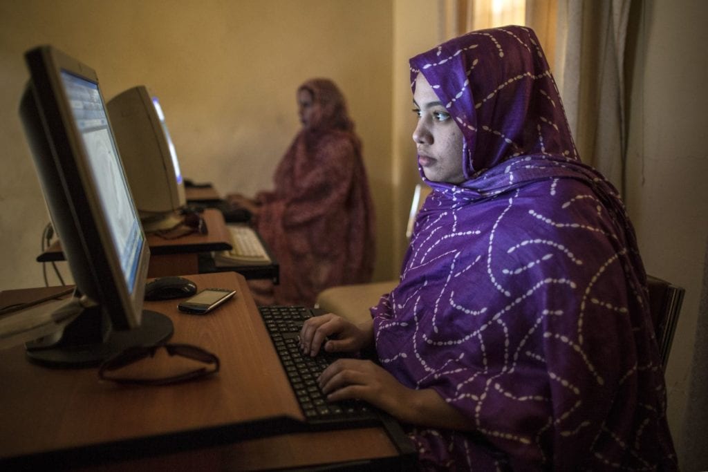 Two women sitting at a computer