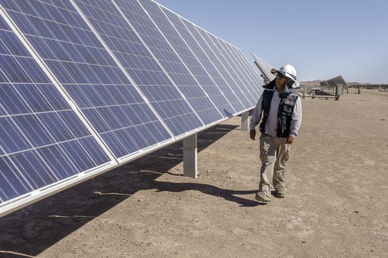 A man controls solar panels