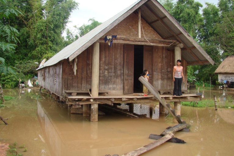 A house on stilts during flood